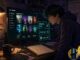 Anime-style home office scene with Jellyfin 12.0 upgrade and backup holograms on a monitor