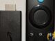 Amazon Fire TV Stick 3rd generation and Alexa Voice Remote on a light surface, September 2026 documentary crop