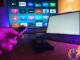Living-room TV and remote with streaming apps including Disney+ on screen (editorial still)
