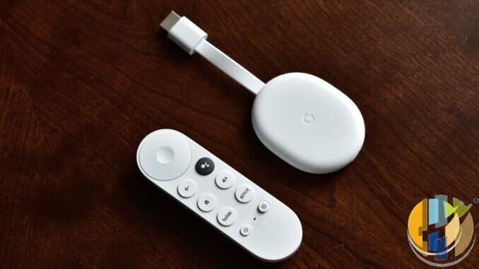 Real Chromecast with Google TV stick and Bluetooth remote on a wooden desk — living-room streaming kit for catch-up and catalogue apps; no EE branding.