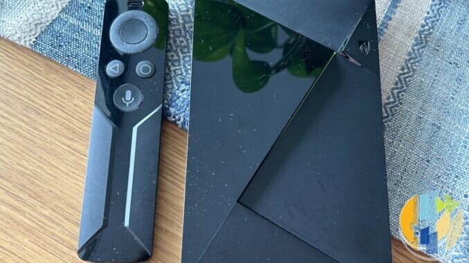 Real NVIDIA SHIELD Android TV console on a desk — Android TV living-room hub hardware in the same class as Freely Android boxes; no Manhattan or Netgem forged marks.