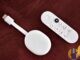Real Chromecast with Google TV stick and remote on a desk — Freely-plus-apps stack living-room hardware; no forged Sky Stream logos.