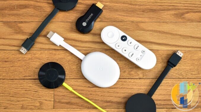 Real collection of Chromecast streaming sticks and a Google TV remote laid out on a wooden desk — multi-generation stick hardware for side-by-side comparison context; no Strong or Xiaomi forged marks.