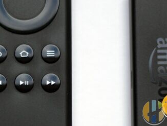 Amazon Fire TV Stick and Alexa Voice Remote close-up on white surface, husham.com stamp, September 2026