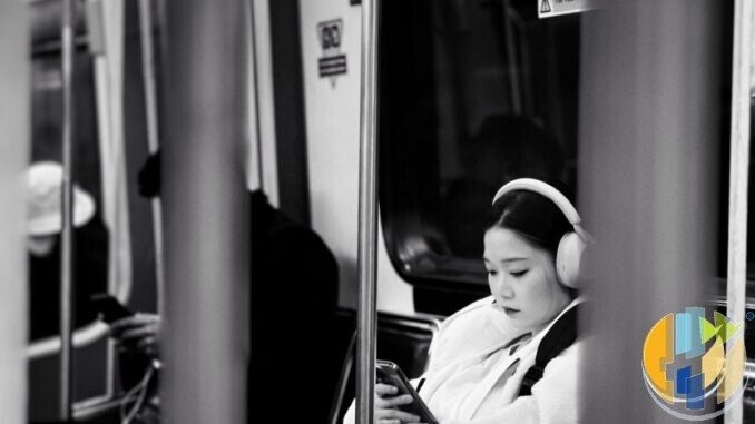 Documentary photo of a woman on public transit looking at her phone — travel and public-network mobile context without VPN brand forge.