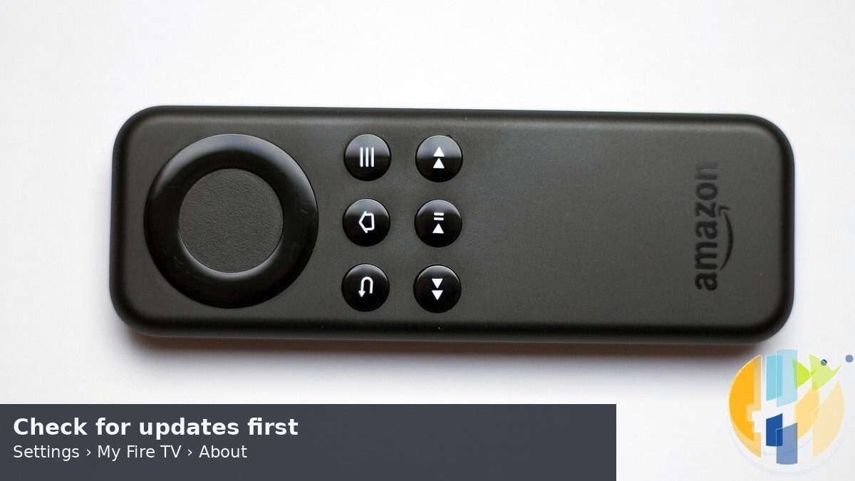 Fire TV Stick remote close-up for Settings Check for updates path, husham.com stamp, September 2026