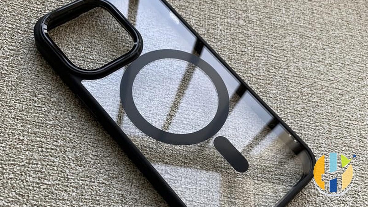 MagSafe-style clear phone case on wood, husham.com stamp