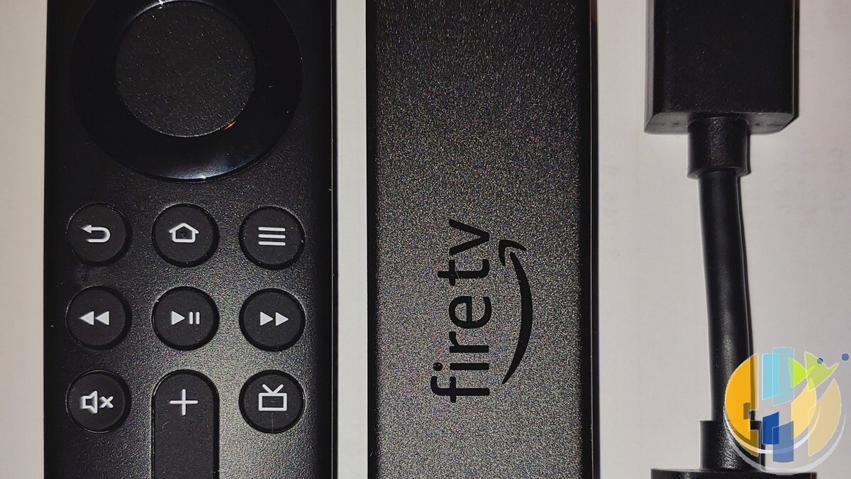 Real Amazon Fire TV Stick 4K Max and remote handheld — compact second-living-room stick hardware without TalkTalk branding.