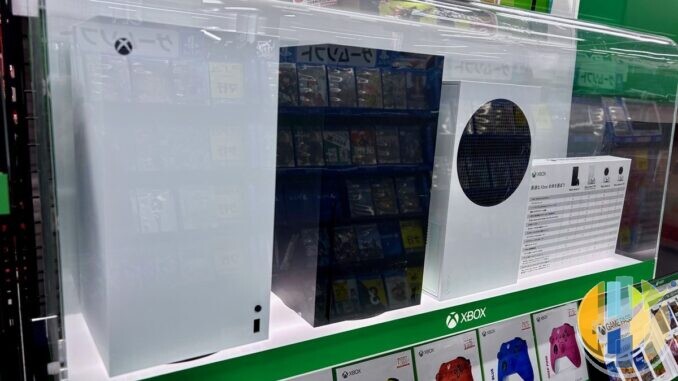 White Xbox Series X and Xbox Series S consoles on display in a games shop