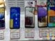 Redmi Note 10, Nokia G20 and Samsung Galaxy A12, A32 and A52 phones on display stands with price tags in a Hong Kong phone shop window