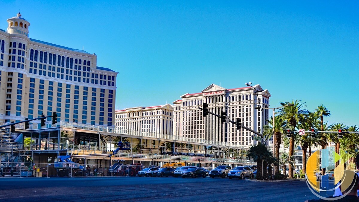 The Bellagio hotel and Caesars Palace on the Las Vegas Strip in daylight, with a temporary two storey hospitality building under construction beside the road for the Grand Prix